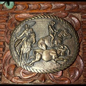Solid brass cowboy and bull belt buckle